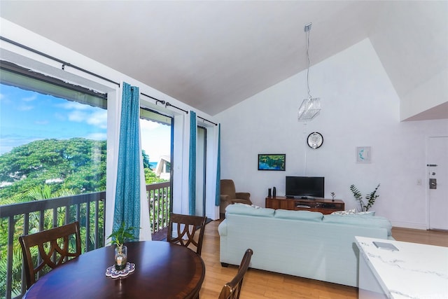 84-718 Ala Mahiku St Unit 21/97C, Waianae, HI 96792 - dining area with vaulted ceiling and light wood-style floors