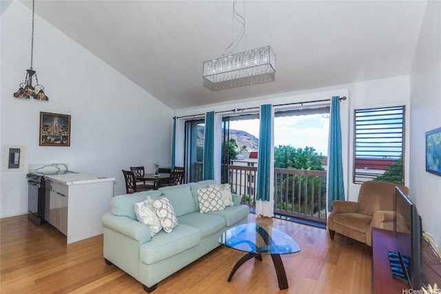 84-718 Ala Mahiku St Unit 21/97C, Waianae, HI 96792 - living room with vaulted ceiling and light wood-style floors