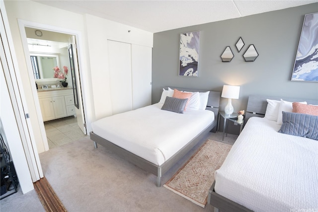 201 Ohua Ave Unit Makai/2808, Honolulu, HI 96815 - bedroom featuring a closet, light colored carpet, and ensuite bathroom