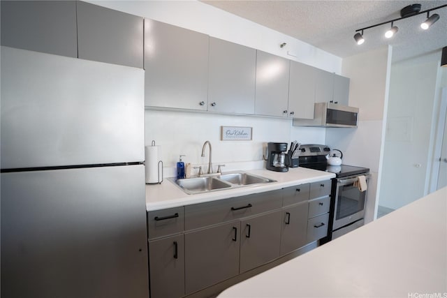 201 Ohua Ave Unit Makai/2808, Honolulu, HI 96815 - kitchen with stainless steel appliances, light countertops, a textured ceiling, and gray cabinetry