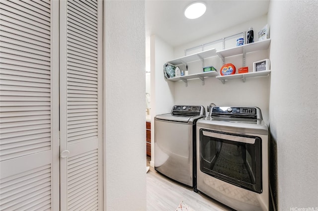 91-630 Kilaha St Unit 1, Ewa Beach, HI 96706 - laundry area featuring washing machine and clothes dryer and wood finished floors