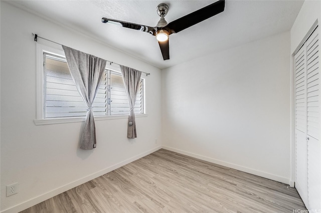 91-630 Kilaha St Unit 1, Ewa Beach, HI 96706 - unfurnished bedroom featuring light wood-style flooring, multiple windows, a ceiling fan, and a closet