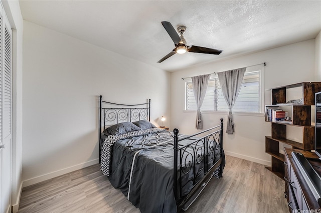 91-630 Kilaha St Unit 1, Ewa Beach, HI 96706 - bedroom with light wood-type flooring and a ceiling fan