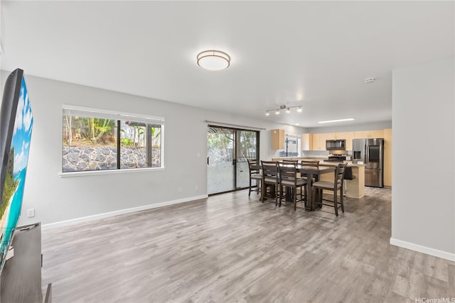 95-1039 Palamoa St Unit 107, Honolulu, HI 96789 - dining area with light wood-type flooring and baseboards