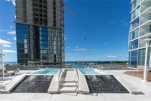 1000 Auahi St Unit 2007, Honolulu, HI 96814 - community pool with a patio, a community hot tub, and a water view