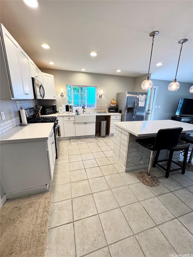 68-3521 E Makuahine St, Waikoloa, HI 96738 - kitchen with range with gas cooktop, refrigerator with ice dispenser, stainless steel microwave, backsplash, and light countertops