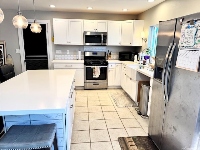 68-3521 E Makuahine St, Waikoloa, HI 96738 - kitchen featuring stainless steel appliances, white cabinets, light countertops, recessed lighting, and light tile patterned floors