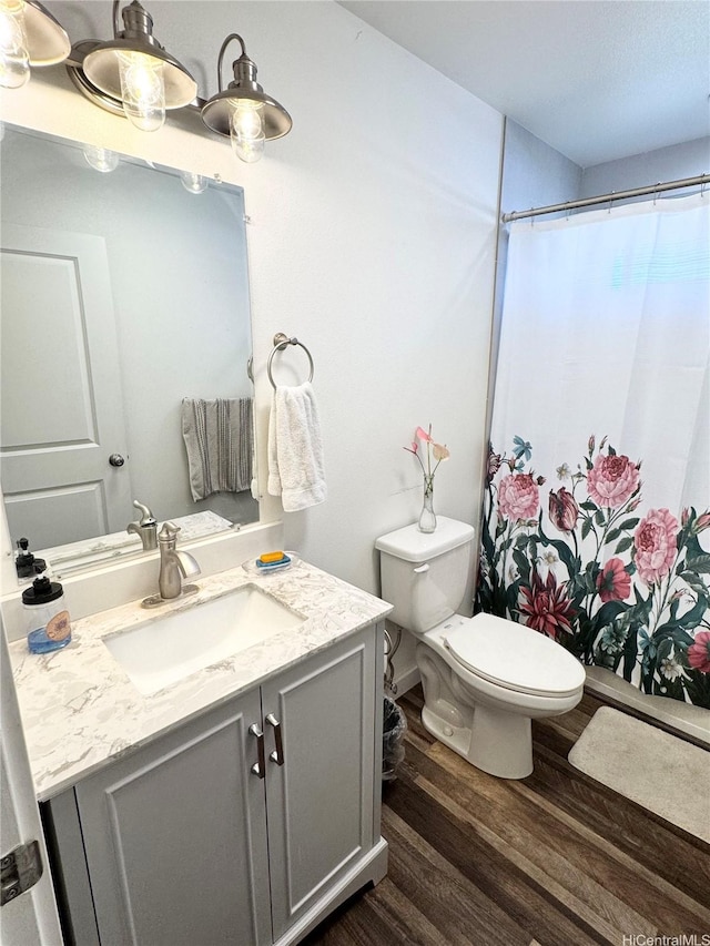 68-3521 E Makuahine St, Waikoloa, HI 96738 - full bathroom featuring wood finished floors, vanity, and curtained shower