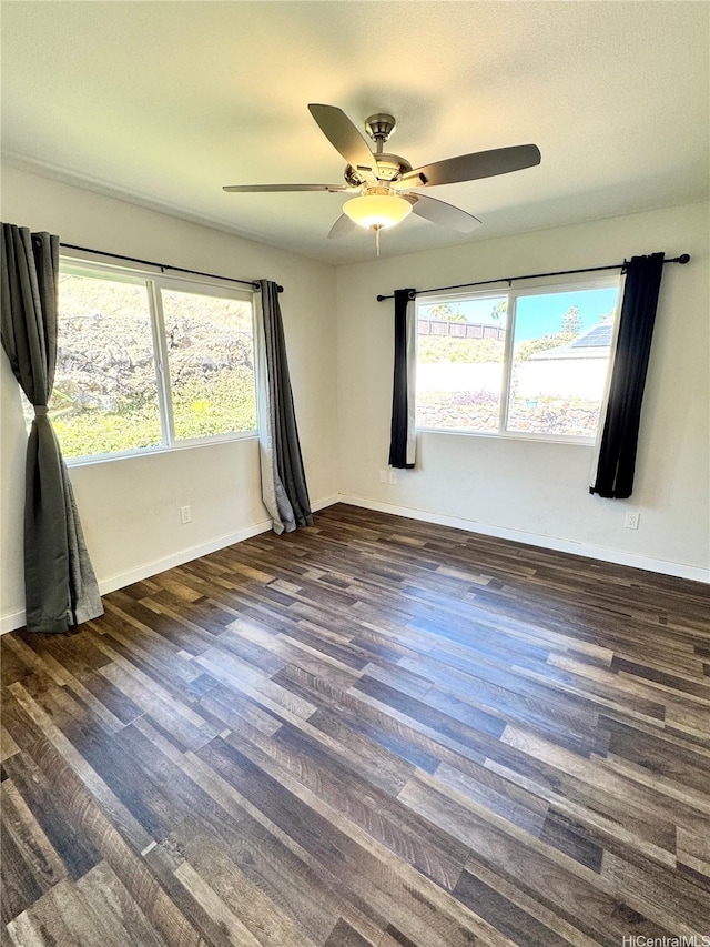 68-3521 E Makuahine St, Waikoloa, HI 96738 - empty room with healthy amount of natural light, a ceiling fan, and wood finished floors