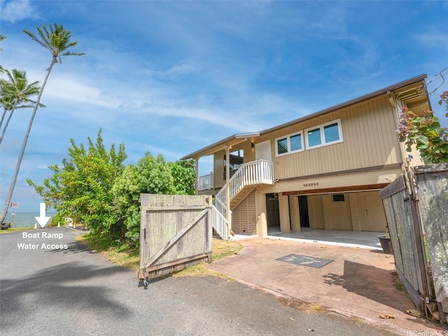 47-070 Laenani Dr Unit C, Kaneohe, HI 96744 - view of front of property with stairway, a garage, and driveway