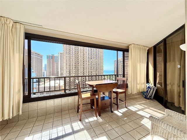 1778 Ala Moana Blvd Unit 2014, Honolulu, HI 96815 - dining area with a skyline view, plenty of natural light, and light tile patterned floors