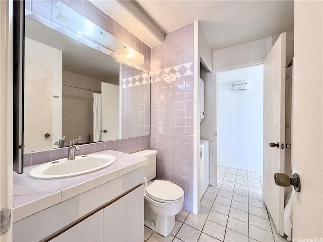 1778 Ala Moana Blvd Unit 2014, Honolulu, HI 96815 - bathroom with tile walls, vanity, and tile patterned floors