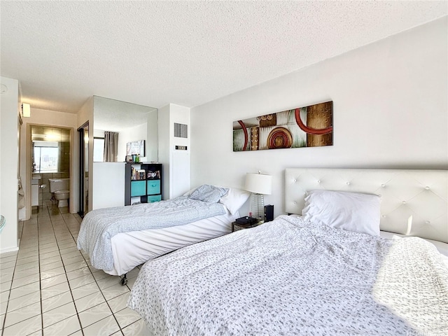 1778 Ala Moana Blvd Unit 2014, Honolulu, HI 96815 - bedroom featuring a textured ceiling, light marble finish flooring, and ensuite bathroom