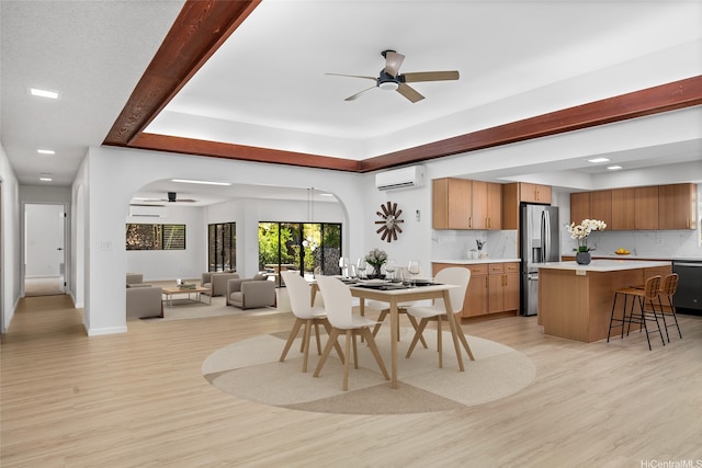 98-653 Papalealii St, Aiea, HI 96701 - dining room with arched walkways, ceiling fan, light wood-style floors, and recessed lighting