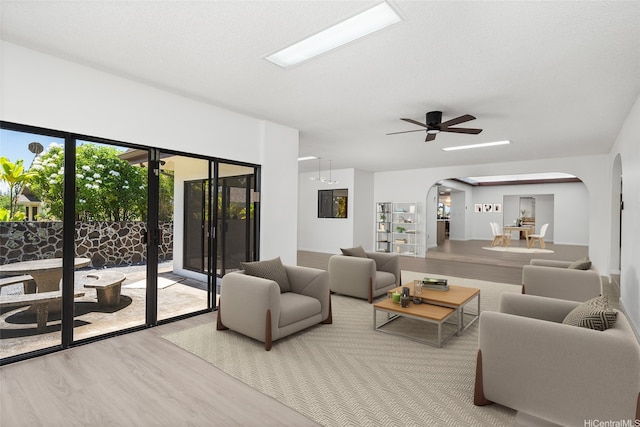 98-653 Papalealii St, Aiea, HI 96701 - living room featuring arched walkways, wood finished floors, and a ceiling fan