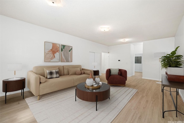 98-653 Papalealii St, Aiea, HI 96701 - living area featuring light wood-style flooring