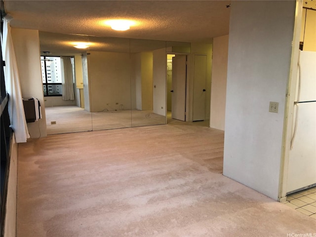 876 Curtis St Unit 1406, Honolulu, HI 96813 - empty room with a textured ceiling and light carpet