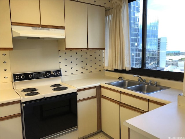 876 Curtis St Unit 1406, Honolulu, HI 96813 - kitchen featuring electric stove, under cabinet range hood, and light countertops