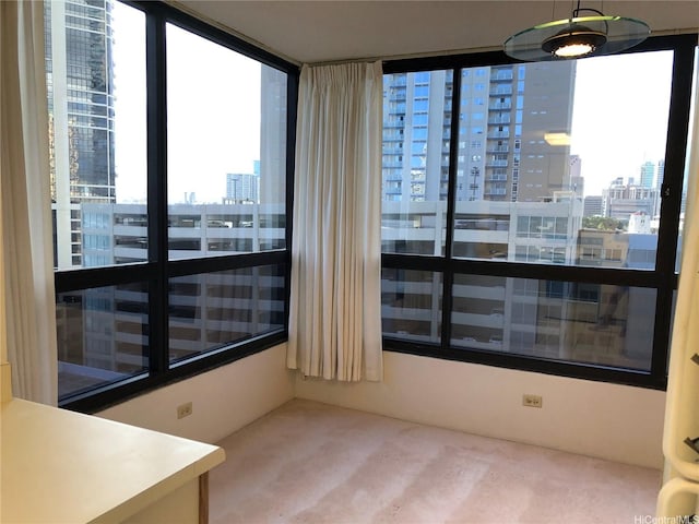 876 Curtis St Unit 1406, Honolulu, HI 96813 - spare room featuring a city view, carpet, and plenty of natural light
