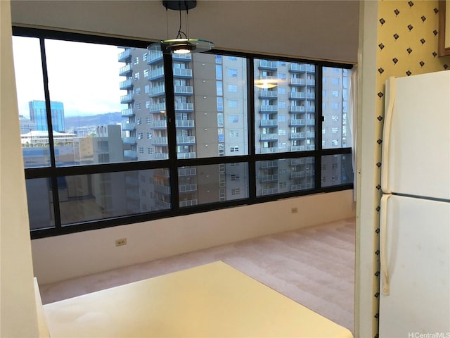876 Curtis St Unit 1406, Honolulu, HI 96813 - unfurnished dining area featuring a view of city, plenty of natural light, and carpet flooring