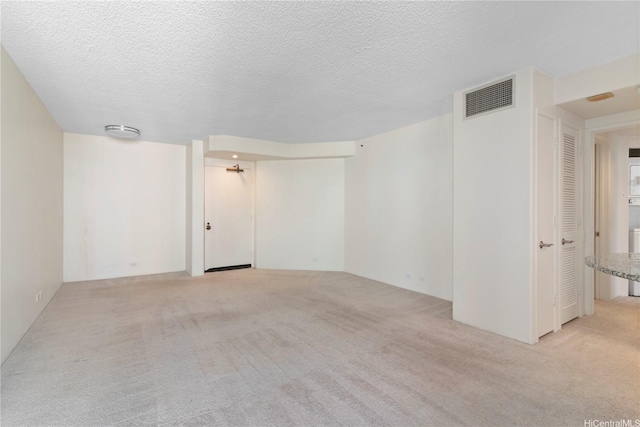 1212 Nuuanu Ave Unit 1104, Honolulu, HI 96817 - spare room featuring light colored carpet and a textured ceiling