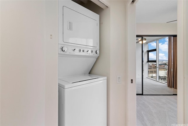 1212 Nuuanu Ave Unit 1104, Honolulu, HI 96817 - laundry area with stacked washer / drying machine and carpet