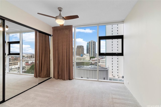1212 Nuuanu Ave Unit 1104, Honolulu, HI 96817 - unfurnished bedroom with carpet floors, a city view, and floor to ceiling windows