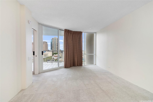 1212 Nuuanu Ave Unit 1104, Honolulu, HI 96817 - carpeted spare room featuring expansive windows and a city view