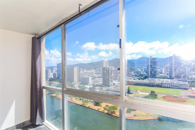 2211 Ala Wai Blvd Unit 2505, Honolulu, HI 96815 - unfurnished sunroom with a city view