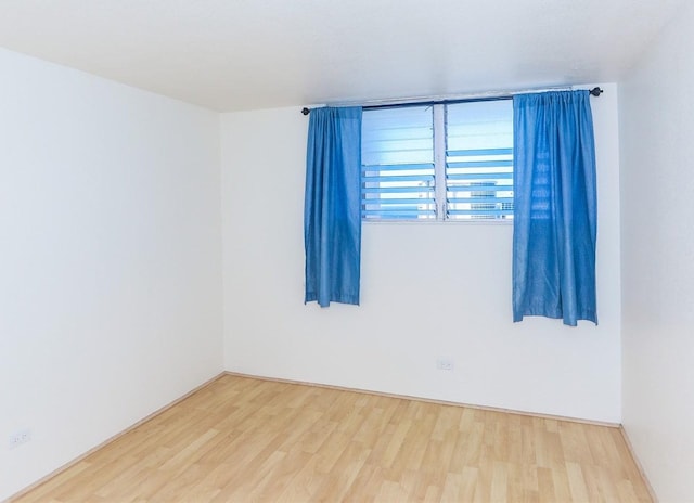 2211 Ala Wai Blvd Unit 2505, Honolulu, HI 96815 - unfurnished room featuring wood finished floors and baseboards