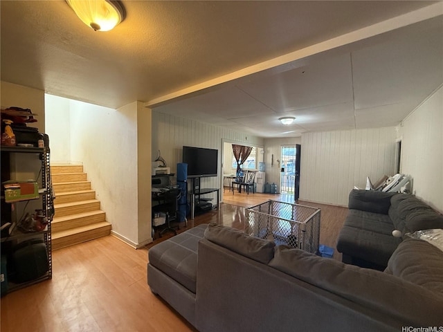 91-1337 Karayan St, Ewa Beach, HI 96706 - living area with light wood-style flooring and stairway