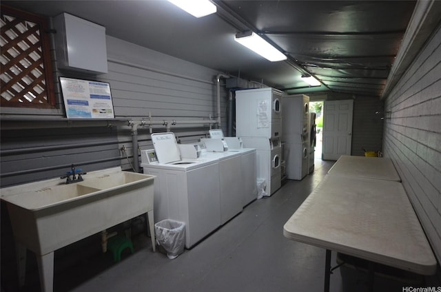 417 Nohonani St Unit 405, Honolulu, HI 96815 - community laundry with stacked washer and clothes dryer, washer and dryer, and wood walls