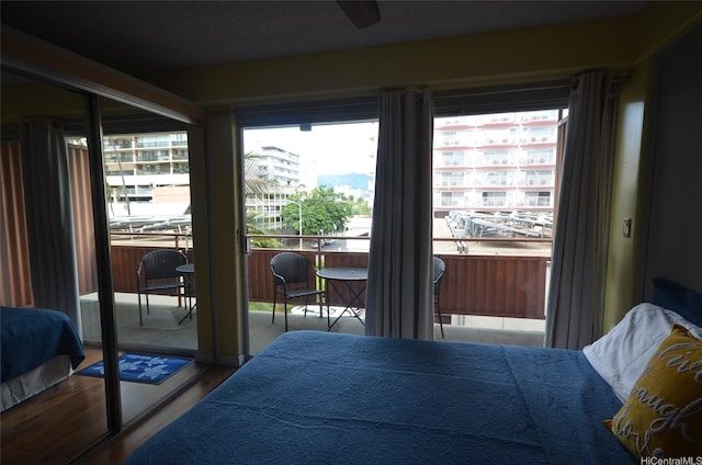 417 Nohonani St Unit 405, Honolulu, HI 96815 - bedroom featuring wood finished floors and access to exterior