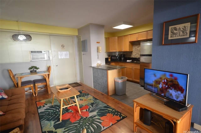 417 Nohonani St Unit 405, Honolulu, HI 96815 - living area with wood finished floors and a wall unit AC