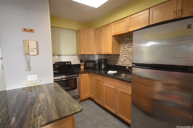 417 Nohonani St Unit 405, Honolulu, HI 96815 - kitchen featuring stainless steel appliances, light tile patterned floors, decorative backsplash, dark stone countertops, and light brown cabinets