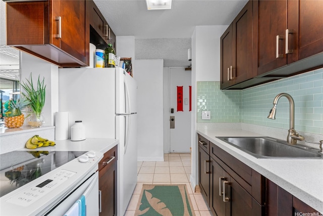 2121 Ala Wai Blvd Unit 2301, Honolulu, HI 96815 - kitchen with electric stove, light tile patterned flooring, light countertops, and backsplash