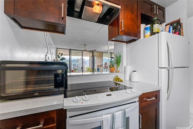 2121 Ala Wai Blvd Unit 2301, Honolulu, HI 96815 - kitchen featuring white appliances, exhaust hood, and ceiling fan