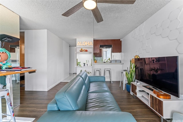 2121 Ala Wai Blvd Unit 2301, Honolulu, HI 96815 - living area with ceiling fan, wood finished floors, and a textured ceiling