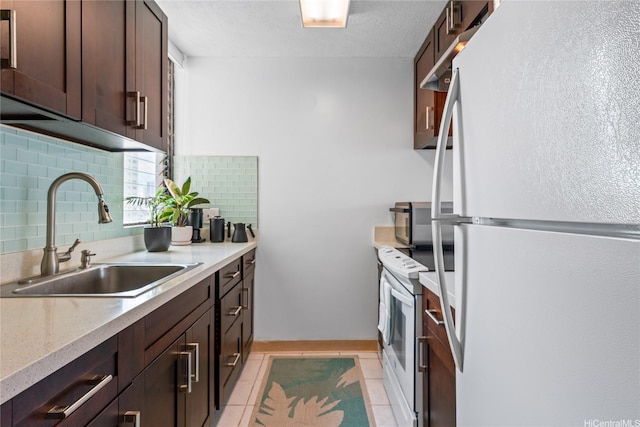 2121 Ala Wai Blvd Unit 2301, Honolulu, HI 96815 - kitchen featuring white appliances, tasteful backsplash, dark brown cabinetry, light tile patterned floors, and a textured ceiling