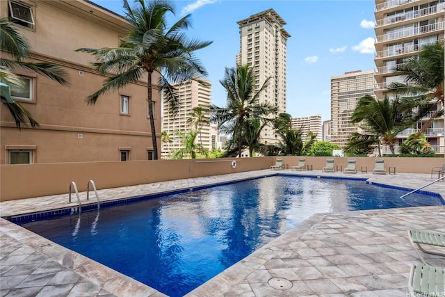 2121 Ala Wai Blvd Unit 2301, Honolulu, HI 96815 - community pool with a view of city and a patio