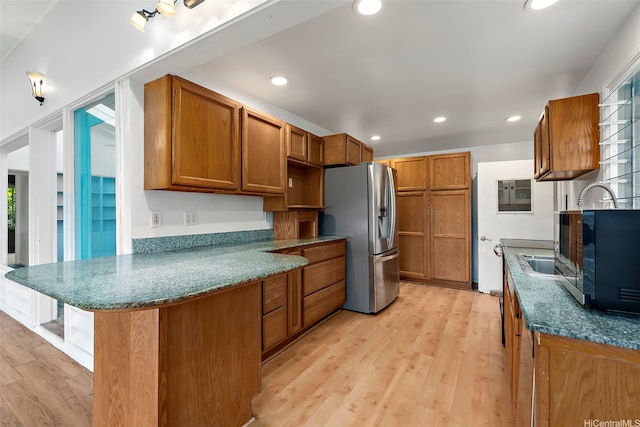 44-151 Bayview Haven Pl, Kaneohe, HI 96744 - kitchen featuring stainless steel fridge with ice dispenser, a peninsula, brown cabinetry, light wood-type flooring, and recessed lighting
