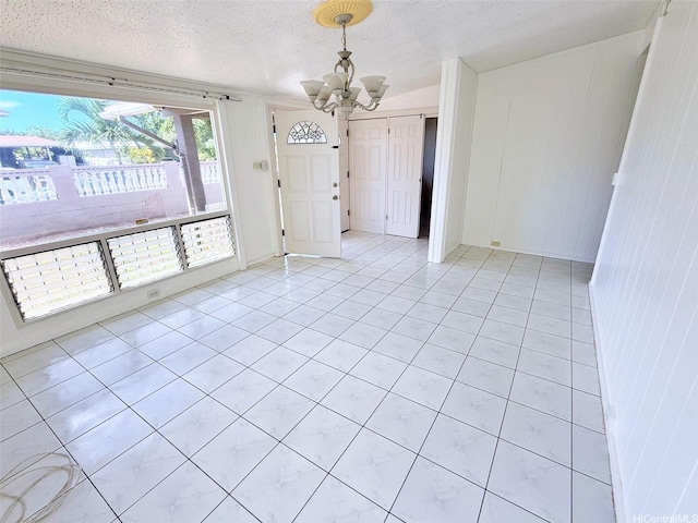 91-1206 Hanaloa St, Ewa Beach, HI 96706 - entrance foyer featuring a chandelier, a textured ceiling, and light tile patterned floors