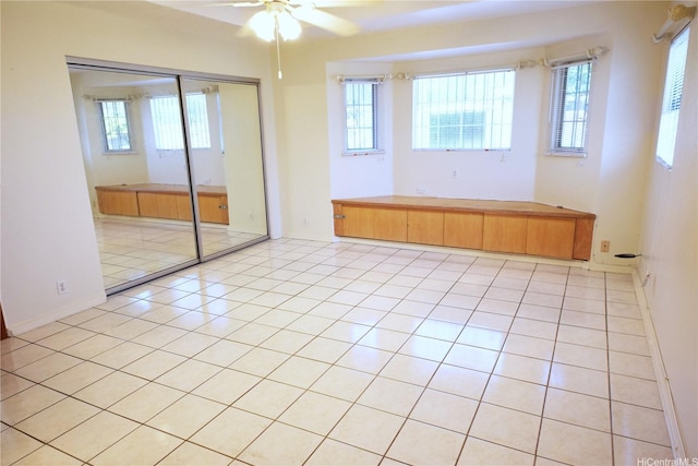 91-1206 Hanaloa St, Ewa Beach, HI 96706 - spare room with plenty of natural light, ceiling fan, and light tile patterned floors