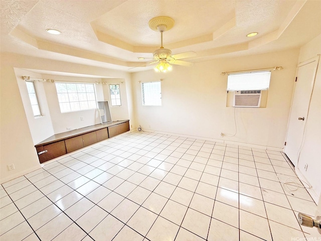 91-1206 Hanaloa St, Ewa Beach, HI 96706 - unfurnished room with a tray ceiling, cooling unit, ceiling fan, a textured ceiling, and light tile patterned floors