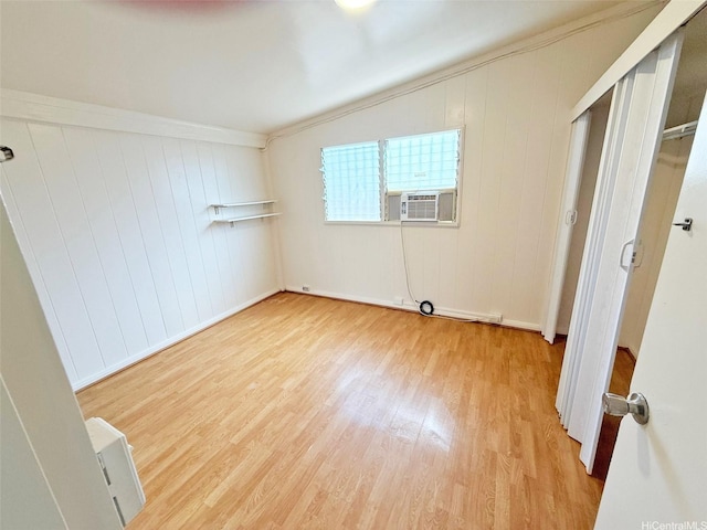 91-1206 Hanaloa St, Ewa Beach, HI 96706 - unfurnished bedroom with wood finished floors, cooling unit, and ornamental molding