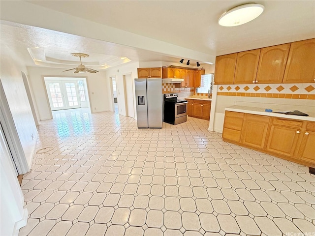 91-1206 Hanaloa St, Ewa Beach, HI 96706 - kitchen featuring appliances with stainless steel finishes, light countertops, tasteful backsplash, under cabinet range hood, and ceiling fan