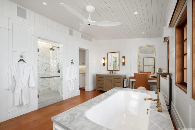 58-153 Napoonala Pl, Haleiwa, HI 96712 - bathroom featuring wooden ceiling, a stall shower, a garden tub, vanity, and wood finished floors