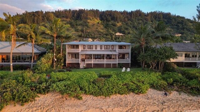 58-153 Napoonala Pl, Haleiwa, HI 96712 - back of house featuring a balcony and a metal roof