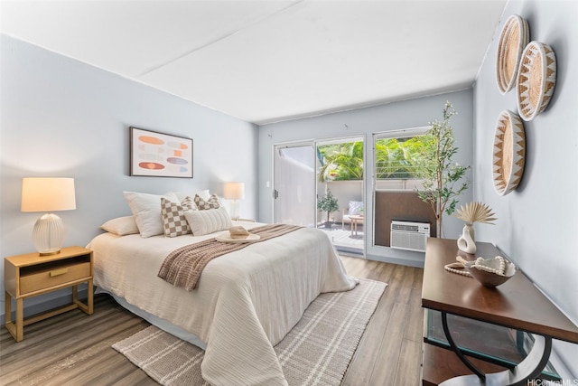 44-130-5 Mui Pl Unit 2605, Kaneohe, HI 96744 - bedroom featuring access to exterior, a wall mounted air conditioner, and wood finished floors