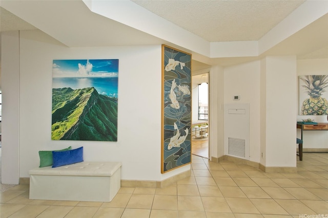 1221 Victoria St Unit 2301, Honolulu, HI 96814 - hallway featuring light tile patterned flooring and a textured ceiling